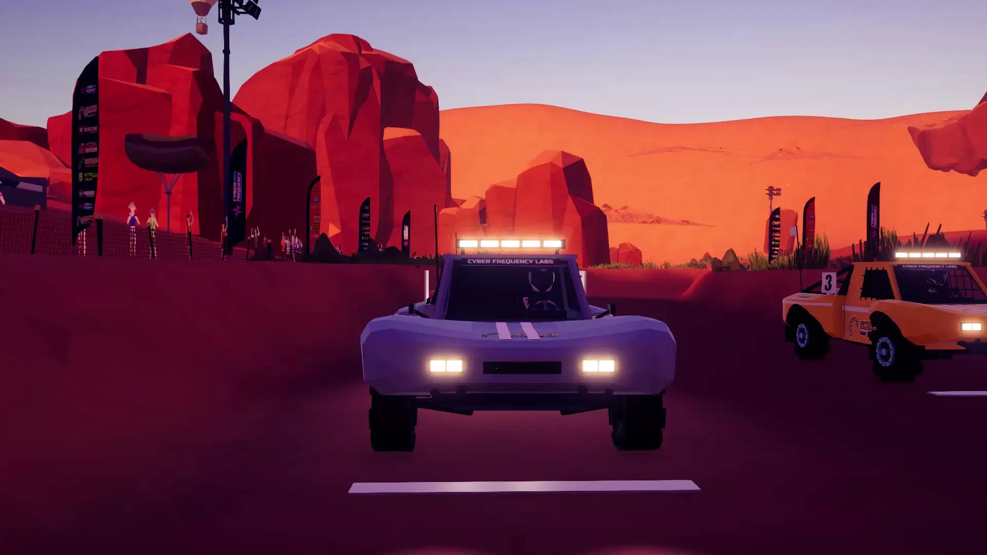Trucks lined up under the floodlights in red-rock Sidewinder Canyon