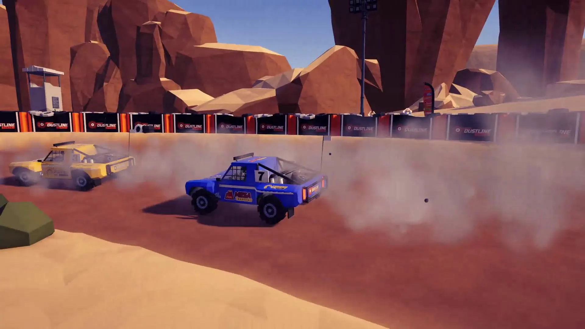 Two trucks kicking up roost on Desert Run with the mesas behind